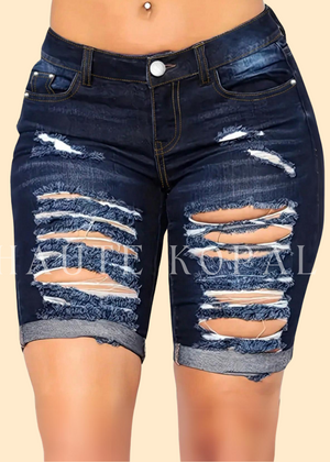 Distressed denim shorts with pockets